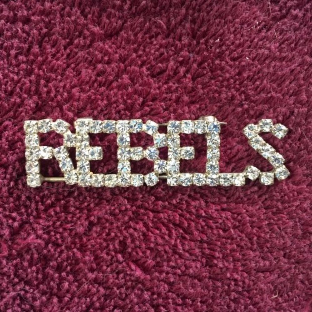 REBELS Clear Rhinestone Pin Brooch Silvertone